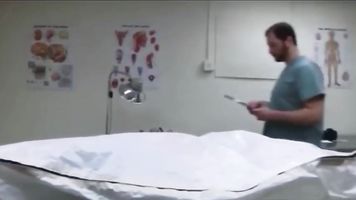 MED Janitor at the Mortuary opens the refrigerator drawers at night p.